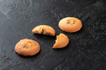 Healthy food concept. Homemade organic energy cookies on black slate stone background with copy space