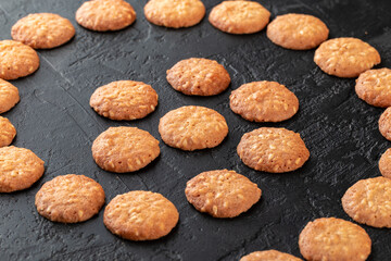Healthy food concept. Homemade organic energy cookies on black slate stone background with copy space