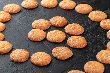 Healthy food concept. Homemade organic energy cookies on black slate stone background with copy space