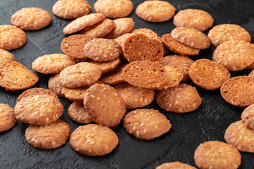 Healthy food concept. Homemade organic energy cookies on black slate stone background with copy space