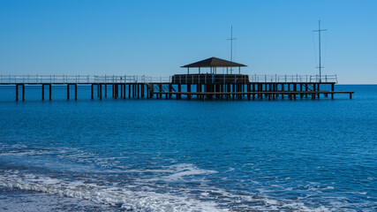 a pier on the beach and calming sea views
