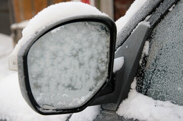 frozen mirror at the car, car in the snow
