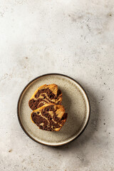 Two slices of zebra cake on a plate, top view, copy space, isolated