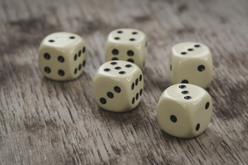 Playing cubes on a wooden table