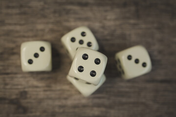 Playing cubes on a wooden table