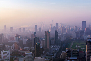 Naklejka premium Dawn over Bangkok. At the height of a bird's flight. Smog hell city. 