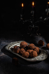 Dark chocolate truffle on dark background