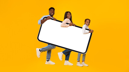 Black family holding heavy white empty smartphone screen