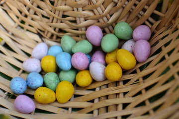 Multi-colored Easter eggs in a basket. Easter