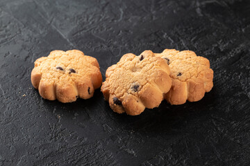Healthy food concept. Homemade organic energy cookies on black slate stone background with copy space