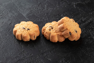 Healthy food concept. Homemade organic energy cookies on black slate stone background with copy space