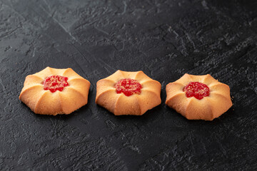 Healthy food concept. Homemade organic energy cookies on black slate stone background with copy space