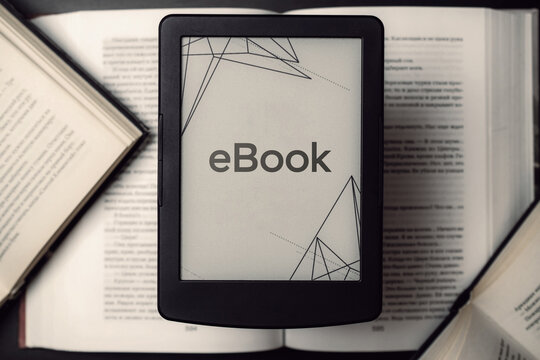 Readers. Digital e book, library reader tablet with books on dark background. Ebook, e learning electronic internet mobility concept.
