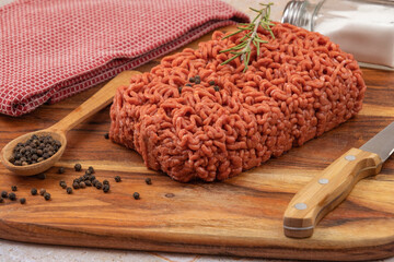 raw beef ground meat, closeup, on a table