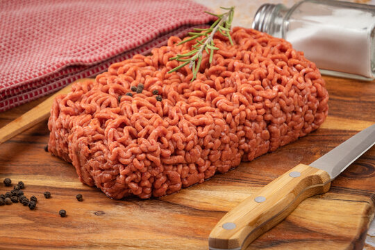 raw beef ground meat, closeup, on a table