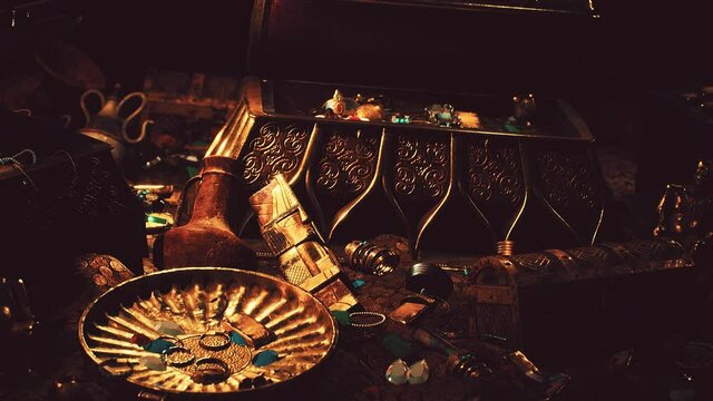 treasures in a dark cave with coins diamonds and gold