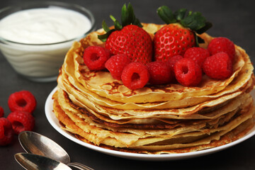 Russian cuisine national dish bliny with fresh berries	