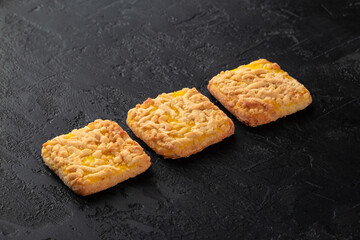 Healthy food concept. Homemade organic energy cookies on black slate stone background with copy space