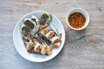 pickled flower crab on plate dipping Thai spicy seafood sauce