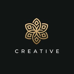 Abstract flower logo with gold color icons and black background
