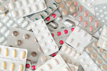 Background of a large group of assorted capsules and pills