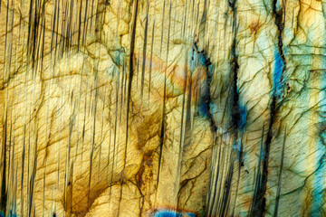 macro mineral stone labradorite on a black background