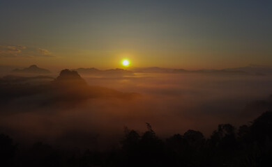 Landscape sunrise over mountains and warm morning sun