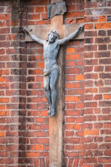 Gothic crucifix figure outside the St. Francis of Assisi (Bernardine) Roman Catholic Church in Vilnius.