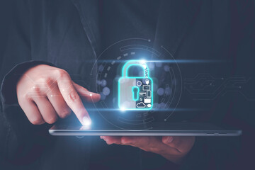 Cybersecurity, privacy, data protection concept. Hand hold tablet and touch Lock icon on modern screen computer network security and financial data with virtual connection, cyber attack privacy data.