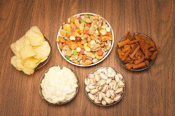 Nuts and snacks, a snack for beer on a dark background.