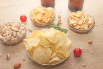 Nuts and snacks, a snack for beer on a light background.