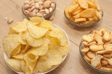 Nuts and snacks, a snack for beer on a light background.