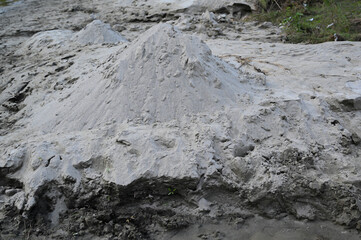 a sand dune carved out of the river .