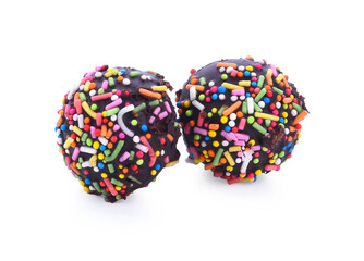 cake pops isolated lying on white table.