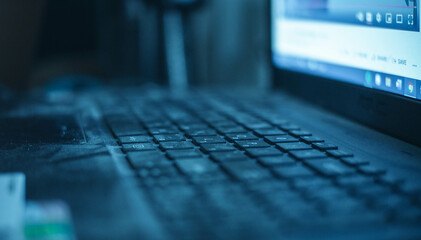 code on computer keyboard, blue screen blue light