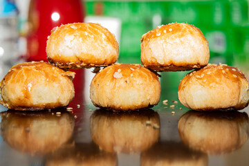 The traditional Chinese food, Shaobing in the shape of chess pieces, is placed on the table