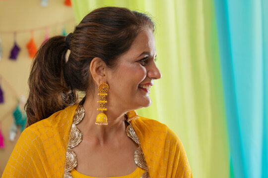 Close-up portrait of an Indian mother during her daughter's haldi ceremony