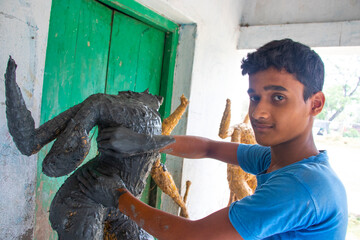 Indian Boy Making Idol Goddess