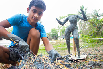 Indian Boy Making Idol Goddess