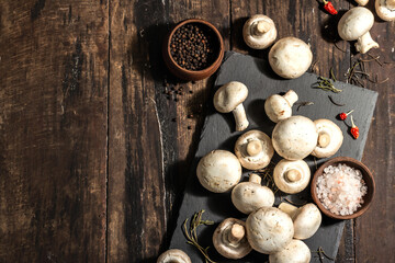 Fresh champignons with spices and herbs. Raw ingredient for cooking vegan food