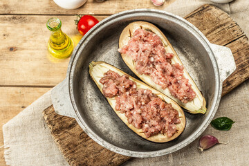 Stuffed eggplant ready to bake with ground meat, vegetables, and spices