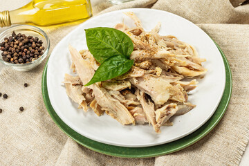 Boiled chicken meat with greens and spices. Low fat animal protein, healthy food lifestyle