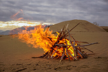 Bonfire on the sand dunes in the Chara desert