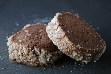 chocolate shortbread cookies on a dark background