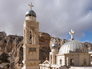 SYRIA. Maalul Monastery is located 60 km from Damascus. Nearby is the village of Kalamondin resembling an eagle's nest. The houses are built on the rocks by steps.