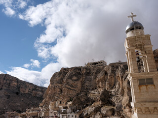 SYRIA. Maalul Monastery is located 60 km from Damascus. Nearby is the village of Kalamondin resembling an eagle's nest. The houses are built on the rocks by steps.