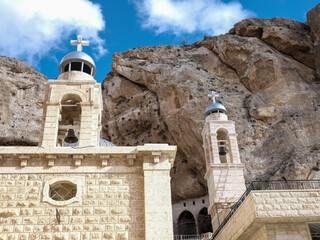 SYRIA. Maalul Monastery is located 60 km from Damascus. Nearby is the village of Kalamondin resembling an eagle's nest. The houses are built on the rocks by steps.
