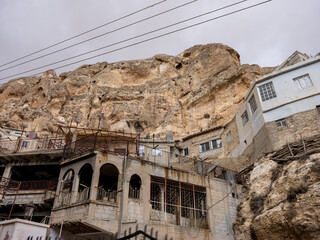SYRIA. Maalul Monastery is located 60 km from Damascus. Nearby is the village of Kalamondin resembling an eagle's nest. The houses are built on the rocks by steps.