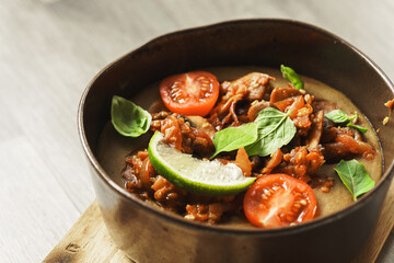 Bowl of thick lentil soup with vegetables