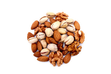 Various mix of nuts - almonds, pistachio, walnuts into the shape of a circle lisolated on a white background. Top view.